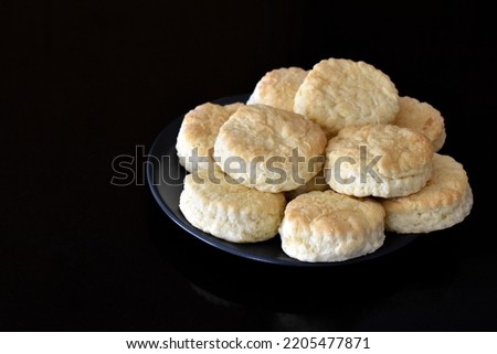 Scones on a plate.  Copy space is on the left side. 