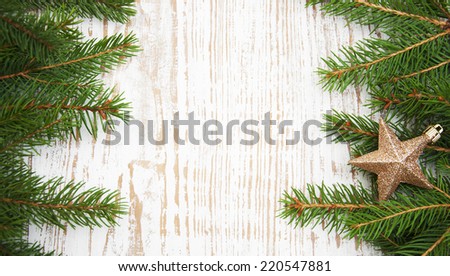 Christmas tree border - branch of evergreen tree with star toy 