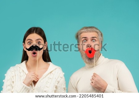 Gender discrimination and sexism. Male and female characters in gender symbols. Couple of woman with moustache and man with red lips. Identity transgender, gender stereotypes. Royalty-Free Stock Photo #2205485401