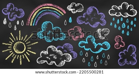 Set of Design Elements Sun, Clouds, Rain, Rainbow of Different Colors Isolated on Chalkboard Backdrop. Realistic Chalk Drawn Sketch. Kit of Textural Crayon Drawings of Sky Symbols on Blackboard. Royalty-Free Stock Photo #2205500281