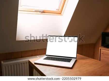 Top view of an open modern laptop blank screen or notebook isolated on table. free space for your copy, view from top.