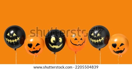 Funny Balloons for Halloween party on orange background