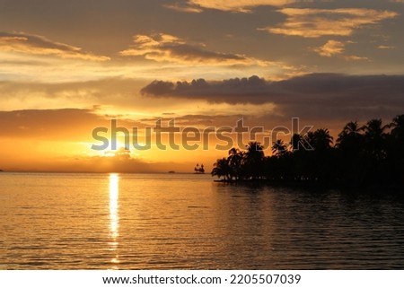 Tropical sunset with Palmtrees Panama Royalty-Free Stock Photo #2205507039