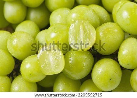 closeup of seedless green Shine Muscat grape background Royalty-Free Stock Photo #2205552715