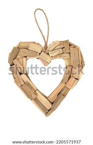 Heart shape driftwood rustic wreath symbol of love and romance. Natural weathered romantic frame for Valentines Day, Mothers Day, anniversary and birthday. On white background,