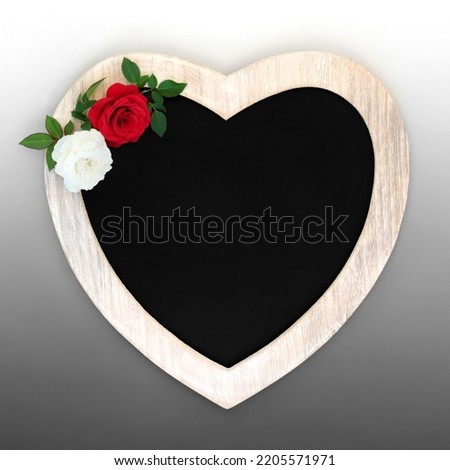 Valentines Day creative modern concept with heart shaped frame, white and red rose flowers on gradient grey background. Minimal beautiful romantic symbol. Suitable for Mothers Day.