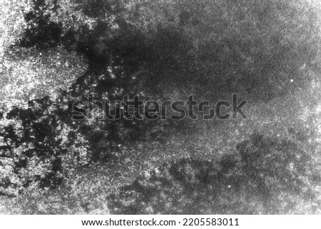 black and white texture of old paper with water stains as a background. grunge texture for design