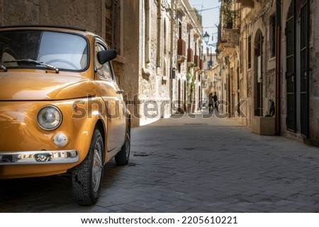 An old Fiat 500 in the old city centre of Syracuse, Sicily, Italy. Royalty-Free Stock Photo #2205610221