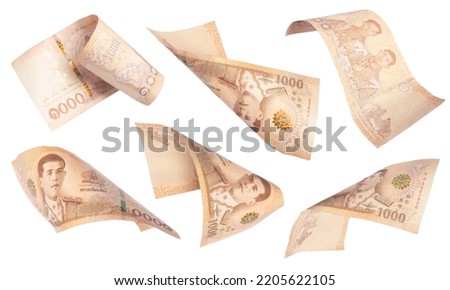 Bank 1000 baht. Falling money isolated on white background, Thailand cash Royalty-Free Stock Photo #2205622105