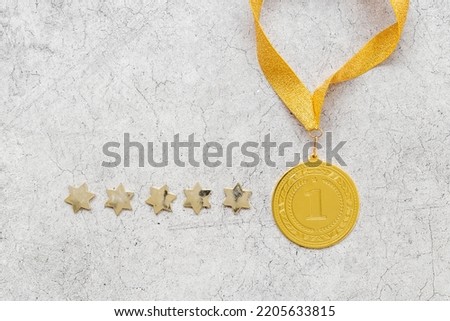 Gold medal first place on ribbon with stars. Winner concept