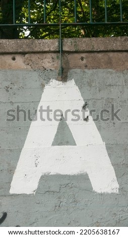 Painted letter a in a wall