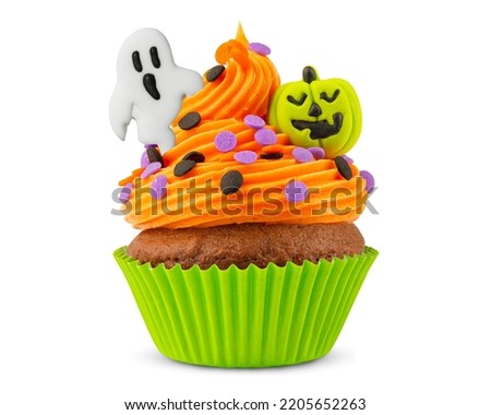 Cupcake on Halloween. Pumpkin Jack o lantern and ghost. Dessert on Halloween party. Muffin decorated with colored sprinkles, candy, frosting and Icing. Chocolate cupcake or cake. 100% White background