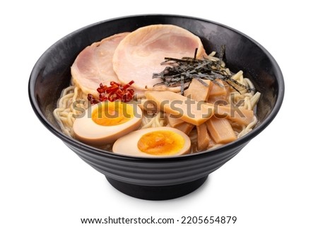 Asian ramen noodles soup with egg, pork and bamboo shoots in bowl is isolated on white background, Japanese cuisine