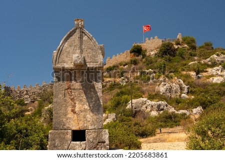 Ancient Lycian tombs and Simena castle near the sunken city of Kekova, Aegean coast, Kas, Turkey