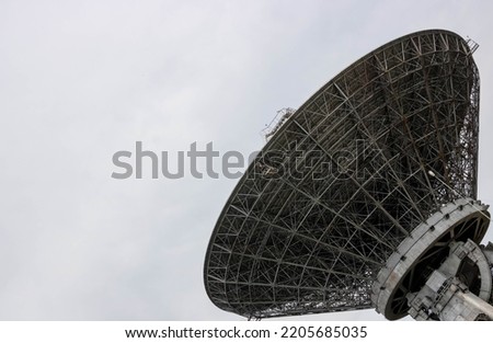 The silhouette of a satellite dish or radio antenna. Space observatory or air defense radar Royalty-Free Stock Photo #2205685035