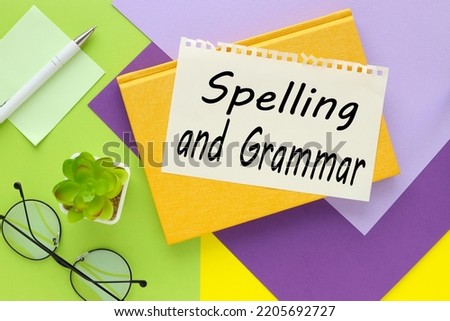 SPELLING GRAMMAR. text on paper on yellow and green background