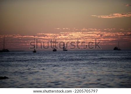 Sunset over sea with golden dramatic sky panorama. Calm sea with sunset sky. Ocean and sky background. Summer and blue sky with blue sea waves soft surface and beauty sunset.