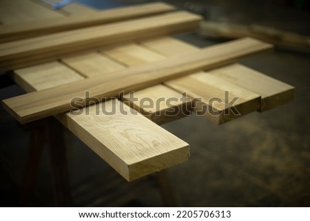 Boards for construction. Joinery. Lots of boards. Wood products. Creation of furniture.