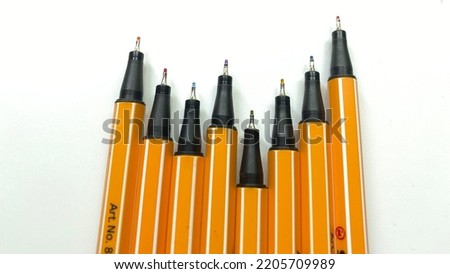 Stack of colorful of color pens isolated on white background