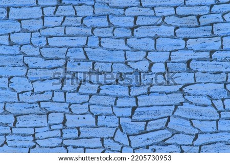 Blue stone old brick wall, modern exterior texture, facade background.