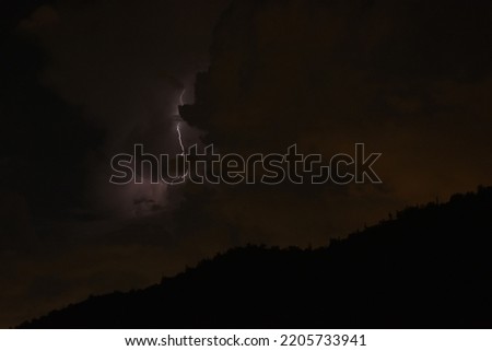 Lightning bolt strike during thunderstorm haboob monsoon stormy storm nature moody weather