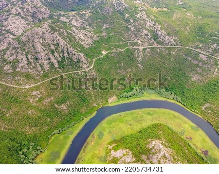 Canyon of Rijeka Crnojevica river near the Skadar lake coast. One of the most famous views of Montenegro. River makes a turn between the mountains and flows backward Portrait of a disgruntled girl