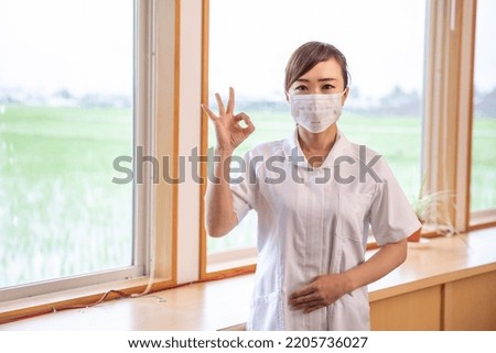 Masked nurse Asian woman (dental ,  medical staff)