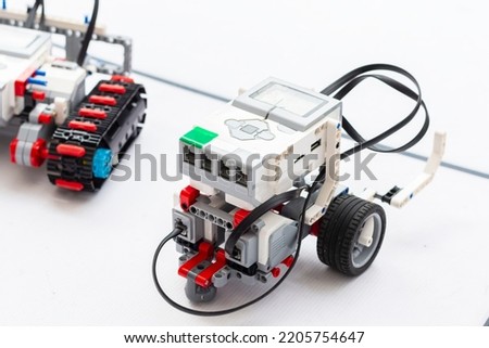 Professional toy RC models of robots radio control. Natural lighting. Teaching children RC modeling. Homemade radio controlled robots, selective focus, with copy space Royalty-Free Stock Photo #2205754647