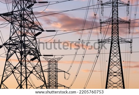 high voltage towers pylon on sunset background Royalty-Free Stock Photo #2205760753
