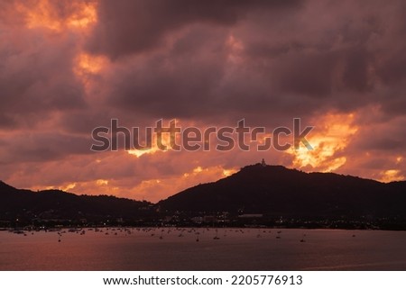 sunset beach panorama. dramatic sky clouds. sunrise morning over mountains. seascape sun silhouette paradise island.