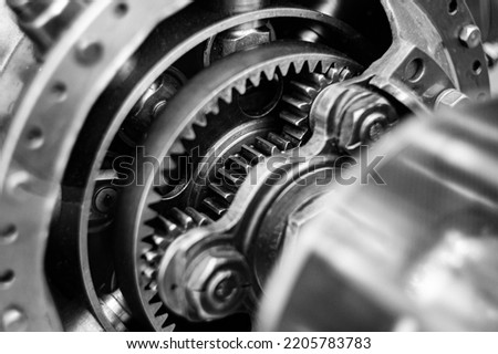 Epicyclic gear train or planetary gearset with cogwheels for torque transfer Royalty-Free Stock Photo #2205783783