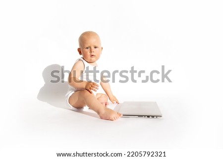 Baby with laptop. Protection, interlock, kids mode, parental control, child lock apps. Technology and lifestyle balance concept. Early childhood education. Children cartoon addiction to gadgets