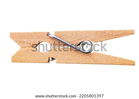 One classic wooden clothespin  isolated on white background. Office clothespins. File contains clipping path. Royalty-Free Stock Photo #2205801397
