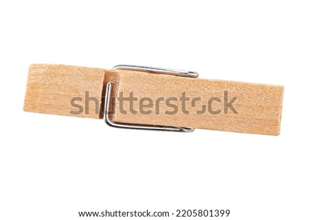 One classic wooden clothespin  isolated on white background. Office clothespins. File contains clipping path. Royalty-Free Stock Photo #2205801399