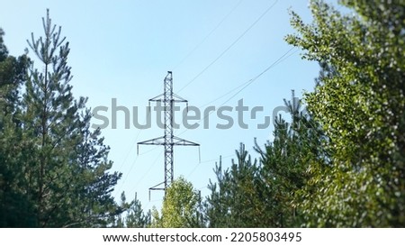 High electric pole in the forest, power line