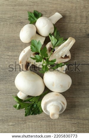 Concept of tasty food with champignon on wooden