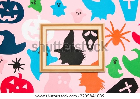 creative halloween background with wooden frame as copy space, halloween paper monsters, paper craft, flat lay
