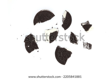 Sandwich chocolate cookies with a sweet cream with crumbs isolated on white background  Royalty-Free Stock Photo #2205841881