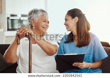 Senior care, healthcare insurance and caregiver woman sitting with elderly woman patient laughing and talking while enjoying retirement home. Old lady and female nurse hospice with health check form