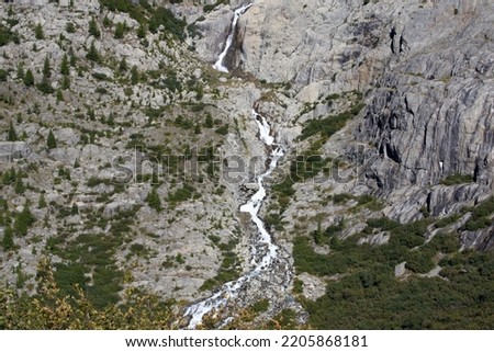 Aerial view of mountain panorama in the Swiss Alps at region of Swiss mountain pass Furkapass with Rhone River on a sunny late summer day. Photo taken September 12th, 2022, Furka Pass, Switzerland.
