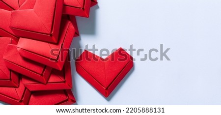 red paper hearts and spaces saying text,Paper hearts on a white background,Red paper heart isolated on white background with copy space