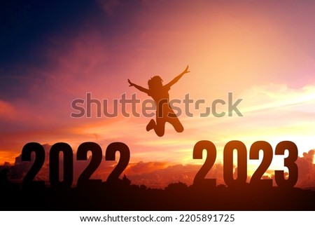 2023 Newyear Silhouette young woman jumping to Happy new year concept. Royalty-Free Stock Photo #2205891725