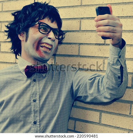 a scary hipster zombie taking a selfie of himself with a smartphone, with a retro effect