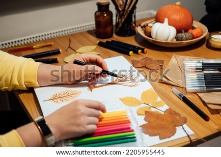Art therapy for mental health recovery, Making Art Helps Improve Mental Health. Creativity and Recovery. Faceless portrait of woman drawing autumn trees with markers