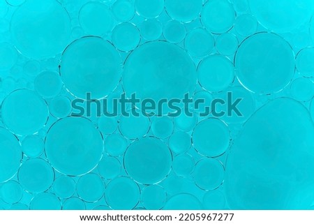 Drops of fat in water. Bubbles of fat close up.Oil
