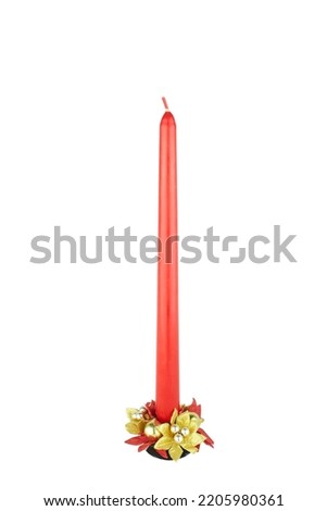 Red Christmas candle isolated on white background.