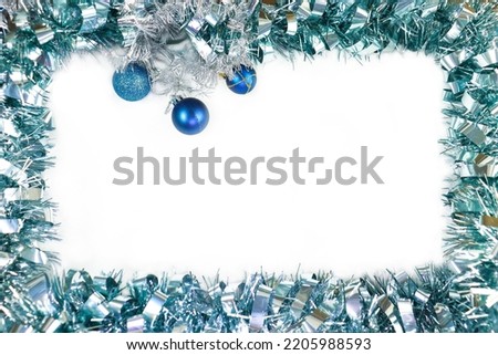Ornament of blue tinsel on a white background. Christmas card