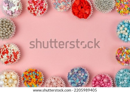 Frame, border, patter from confectionery decor, the sweetest day. Abstract background. Bright background. Royalty-Free Stock Photo #2205989405