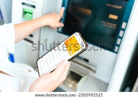 Online payment. Woman holding smartphone with internet online bank application. Debit card wallet app. Save currency money wallet