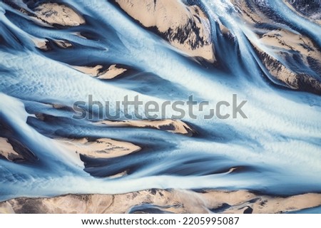 Aerial drone view of fantastic abstract Icelandic glacier rivers melting pattern in summer at highlands of Iceland Royalty-Free Stock Photo #2205995087